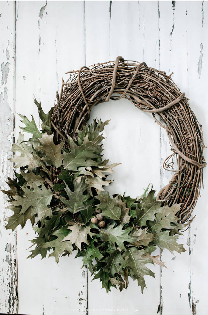Grapevine wreath covered in dried green oak leaves
