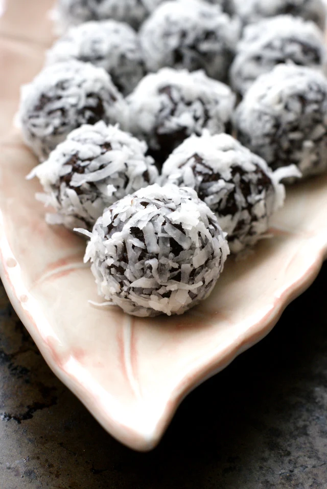 Healthy Coconut Fudge Balls rich chocolatey treats made with simple, whole, paleo approved ingredients.  They will satisfy even the most ravenous sweet tooth!