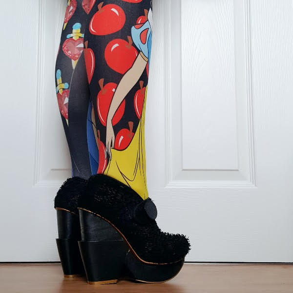 wearing Disney Snow White printed tights with textured black platform shoes