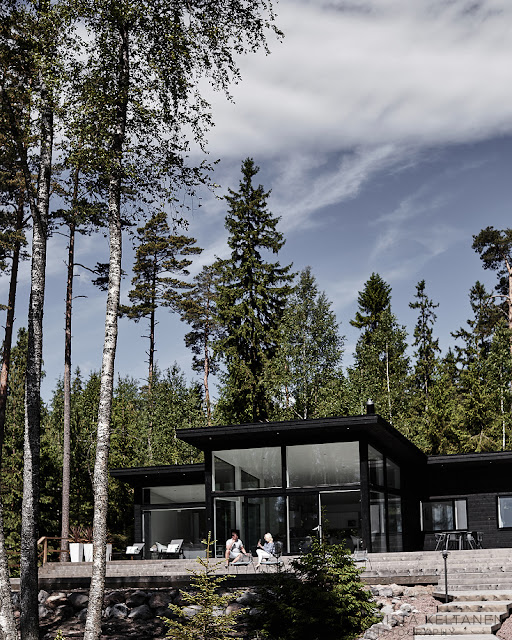 A modern glass walled house in Finland by Krista Keltanen Photography