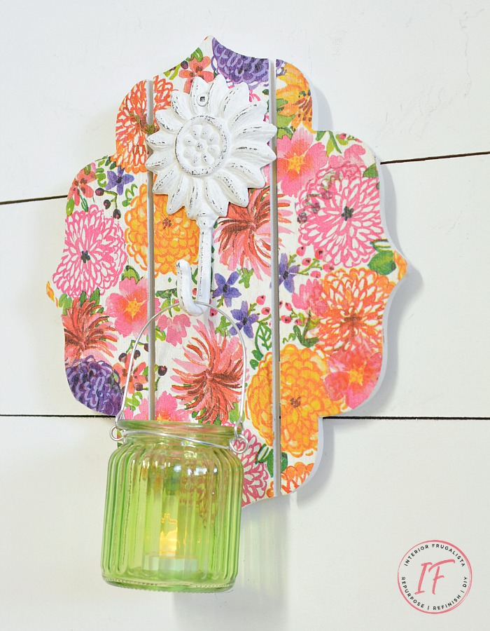 An easy Dollar Store Craft idea with Decoupage Napkins. This DIY Wall Sconce is a budget-friendly Spring or Summer decor idea that can be used as a mason jar candle holder lantern or hanging flower vase.