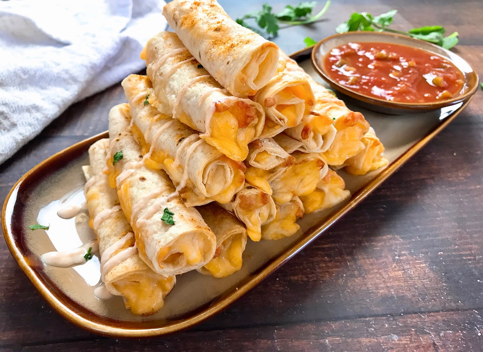 Baked Cheese Taquitos with Spicy Sour Cream