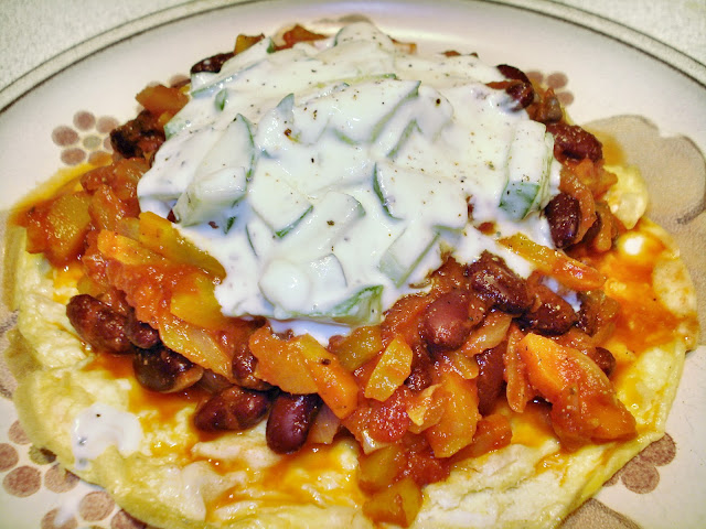 An omelette topped with vegetable chilli and yogurt mint dip