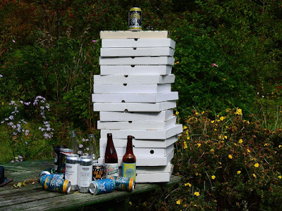 pizza boxes and beer bottles at end of summer