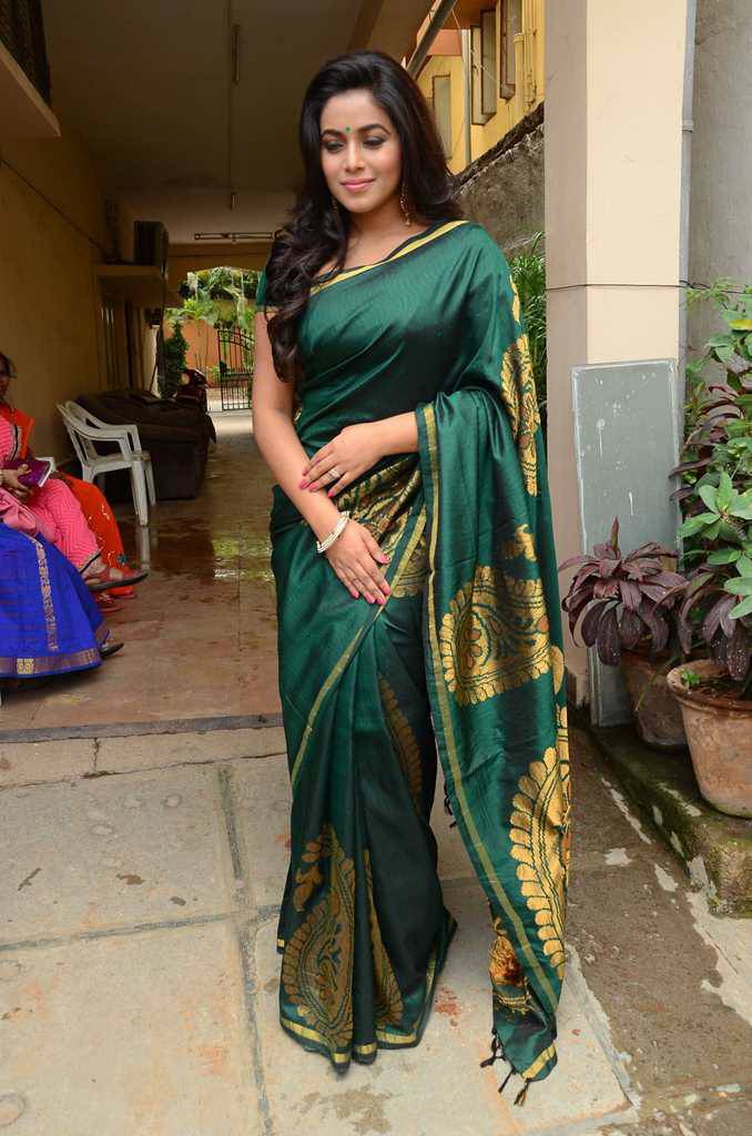 Tollywood Actress Poorna Stills In Green Saree At Fashion Studio Launch