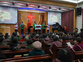 youth singing inside a church in Wenzhou, China