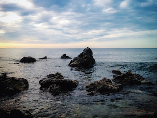 Natural Scenery Of Rocky Beach On The Sea Water In Dusk Light On The Sky At Umeanyar Village North Bali Indonesia