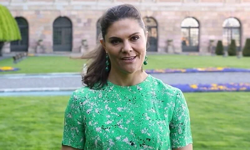 Crown Princess Victoria wore a green floral print dress from Tiger of Sweden, and green earrings from Ebba Brahe Jeweller