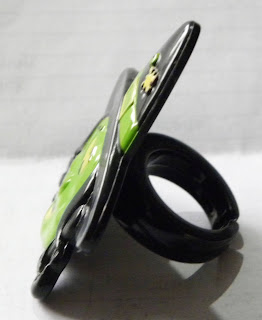 Halloween witch plastic ring from Greggs in black and green