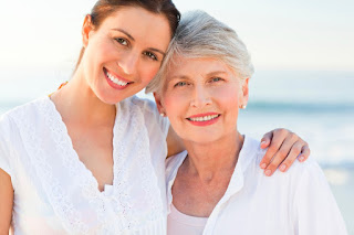 A mother and daughter posing for a picture