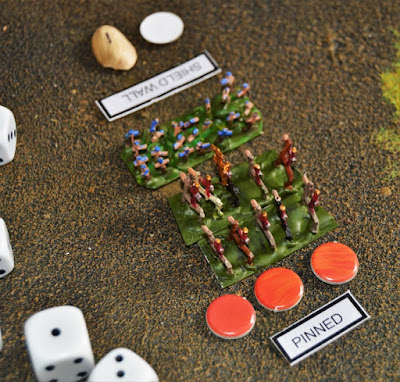 A unit of pinned (under flame ammo fire) Roman cavalry fights a "shielding" unit of Celtic woad warriors.