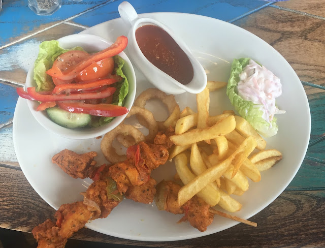 Lemon peri-peri chicken skewers with chips and side salad