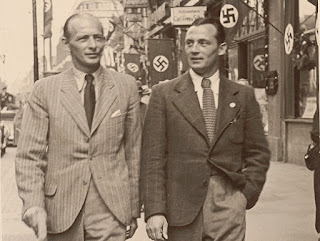 Sindelar a passeggio con Johann "Hans" Mock per le strade di una Vienna già annessa al Reich. Sindelar a passeggio con Johann "Hans" Mock per le strade di una Vienna già annessa al Reich.