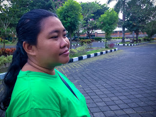 Sweet Woman Smile In The Garden Of The Parking Lot At Badung, Bali, Indonesia