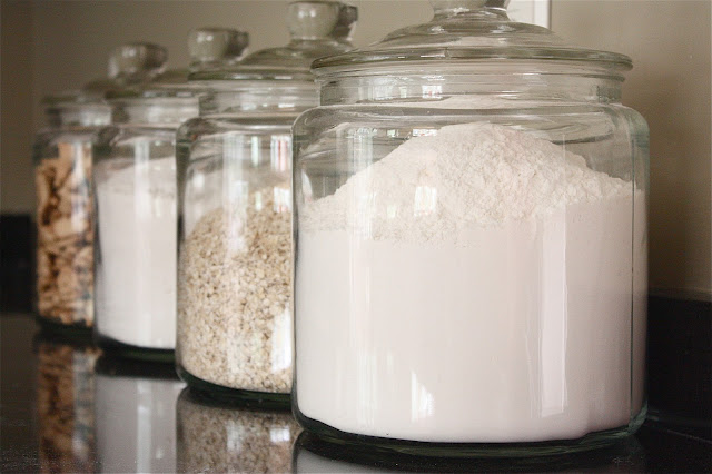 Decorating with glass canisters in the kitchen (Photo via The Yellow Cape Cod) | anderson + grant