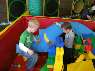 soft play area making a den with giant lego bricks