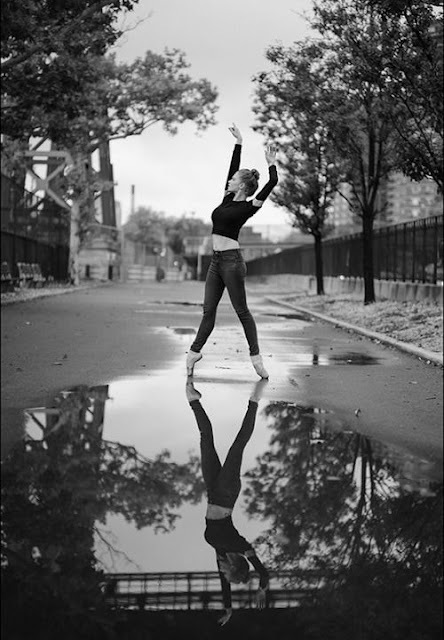Claire Robbins, dancing on a wet street