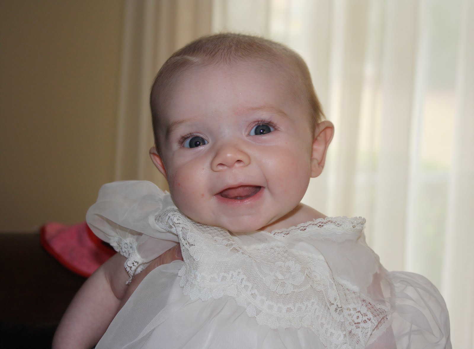 The Johnson Family: A toothless grin and Baby dedication...