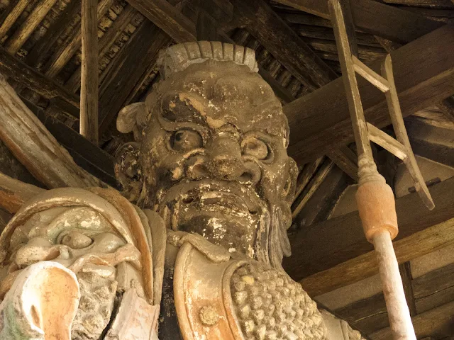 Stern-faced god at a temple in Pingyao, China