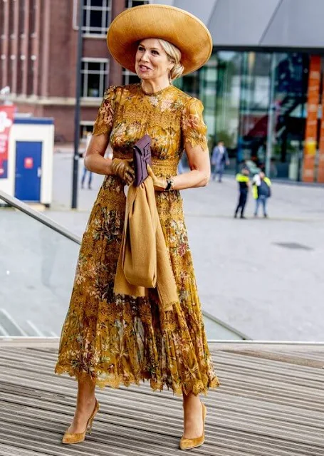 Queen Maxima wore a mustard yellow floral print dress by Zimmermann. Zimmermann Tropicale crinkle dress