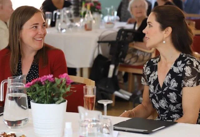 Crown Princess Mary wore a new floral wrap dress from Ralph Lauren, and Gianvito Rossi pumps, Dulong Esme bracelet, Cartier Love Bracelet