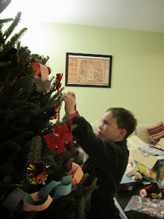 Dash decorating the tree.