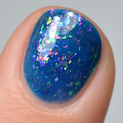 blue jelly nail polish with color shifting flakies swatch