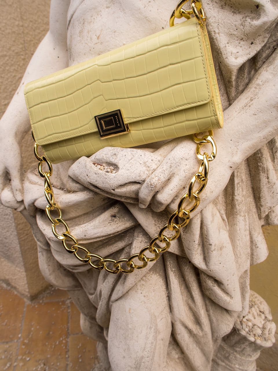 bag, yellow bag, a.cloud milano, roman statue, photoshoot, editorial, vanilla custard color, yellow clutch bag