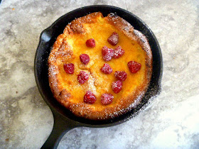 Lemon Raspberry Dutch Baby: A tender, eggy, over-sized pancake laced with bright lemon and topped with tart fresh raspberries.   As wonderful to eat as it is spectacular to look at, no one has to know how easy this is to make! - Slice of Southern