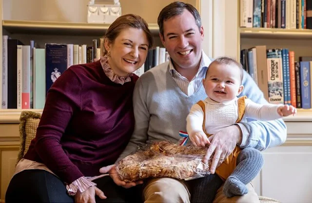 Prince Guillaume, Princess Stephanie and Prince Charles. Boden and Jacadi Paris. Burgundy sweater and gold earrings