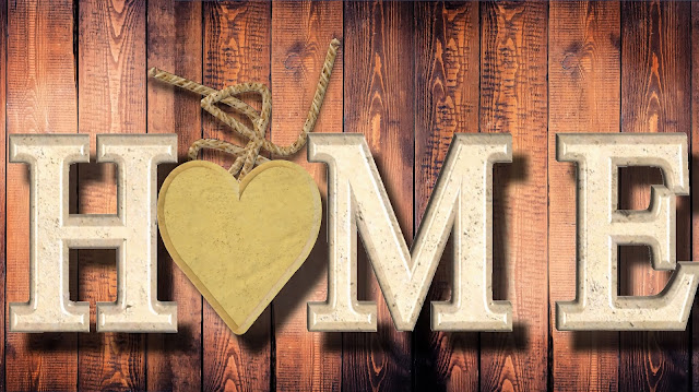 the word home over some wood panels