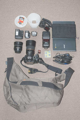 My Lowenpro Passport Sling bag and it's usual contents