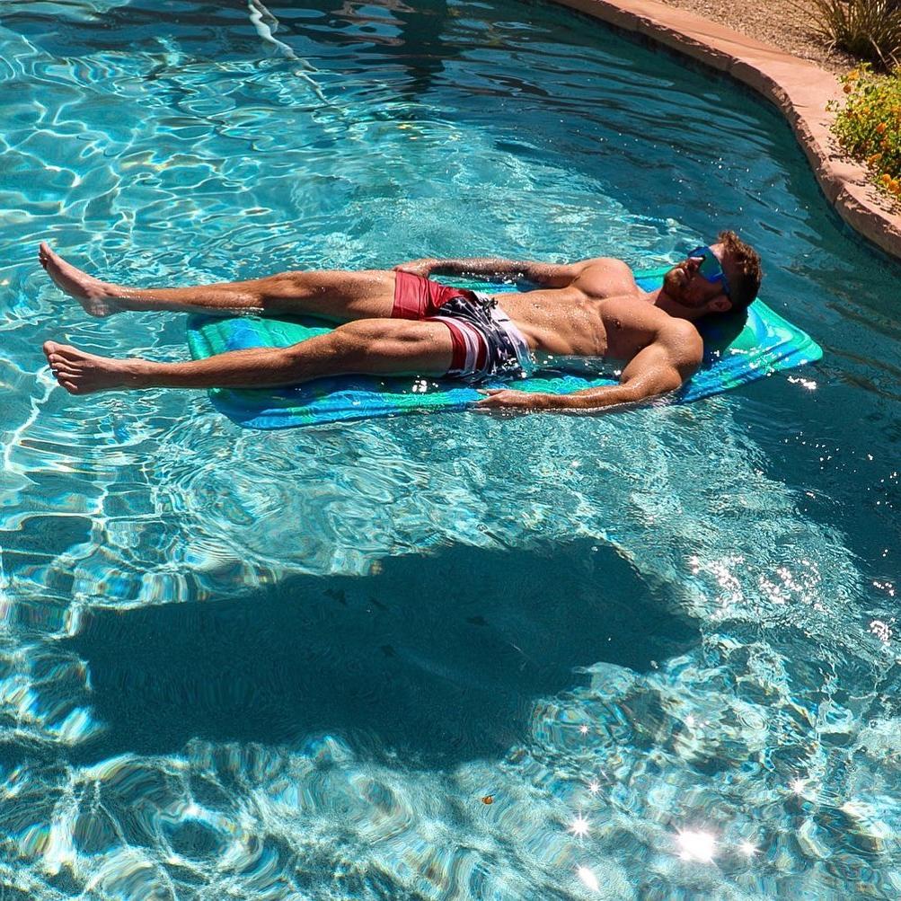 hot-shirtless-guys-brenton-ross-simmons-laying-pool-bed-summer