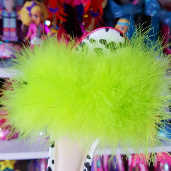 close up of neon marabou feather trim on front of sandal