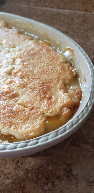 Peach cobbler in stone dish