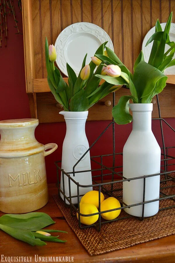 Antique Farmhouse Milk Crate with flowers in milk glasses, lemons on a pine server