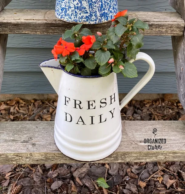 Photo of enamelware coffee pot with a Fresh Daily decor transfer on the front