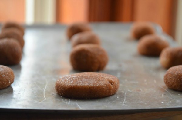 Brown Butter Snickerdoodle Cookie dough balls on a cookie sheet.