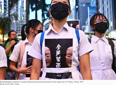 Hong Kong schoolgirls defy Lam's anti-mask law