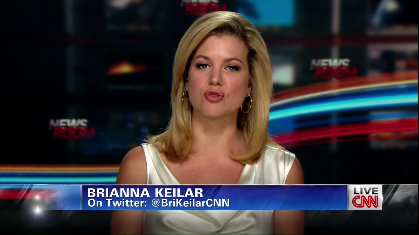 Brianna Keilar - white satin dress/top.