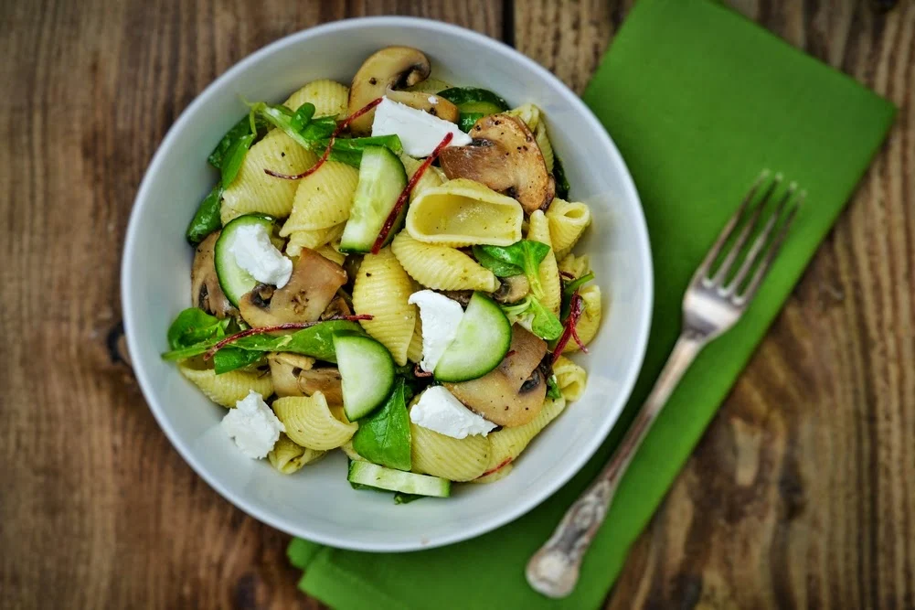 a bowl of Conchiglioni Pasta Salad with Sautéed Mushrooms and Goats' Cheese