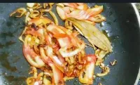 Frying tomato onion with spices for paneer masala recipe