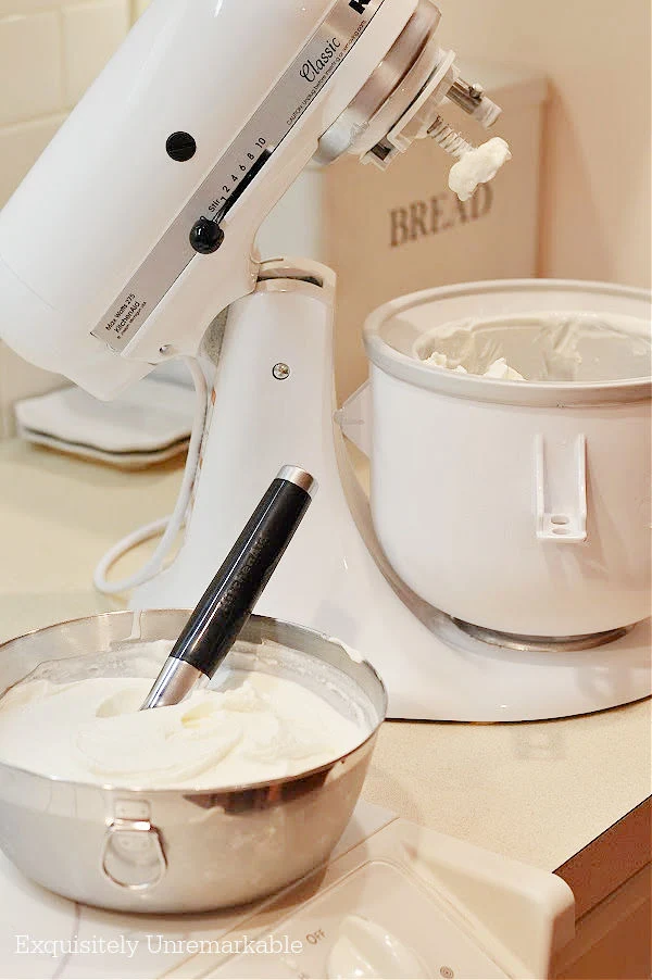 KitchenAid Ice Cream Attachment on mixer with both of ice cream beside it