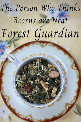 Photo of tea leaves in a cup with text reading "for the person who thinks acorns are really neat: Forest Guardian"