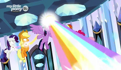 The Mane Six, floating and with white eyes, use the Elements. Twilight fires a rainbow of light to the bottom right of the screen