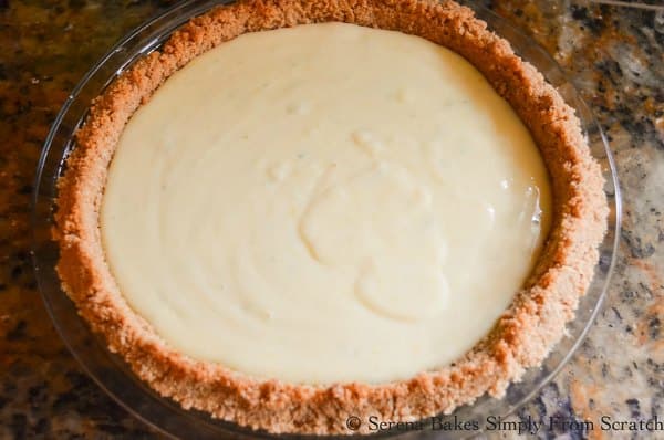 Pour Key Lime Pie filling into prepared graham cracker pie crust for a favorite Thanksgiving Pie from Serena Bakes Simply From Scratch.