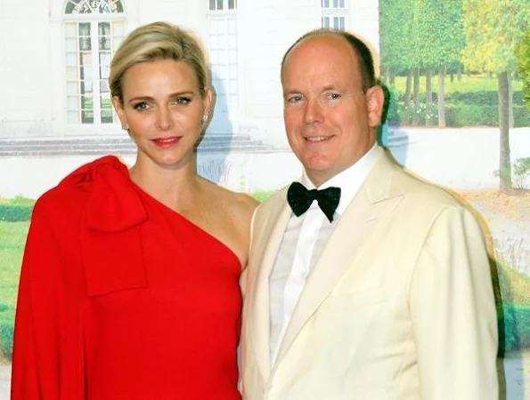  Princess Charlene of Monaco wore Valentino One Shoulder Jumpsuit in Red.