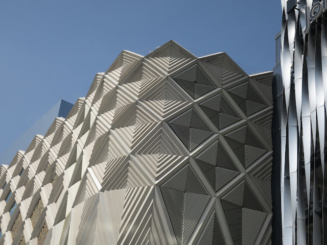 The sides of two buildings in Leeds, England.