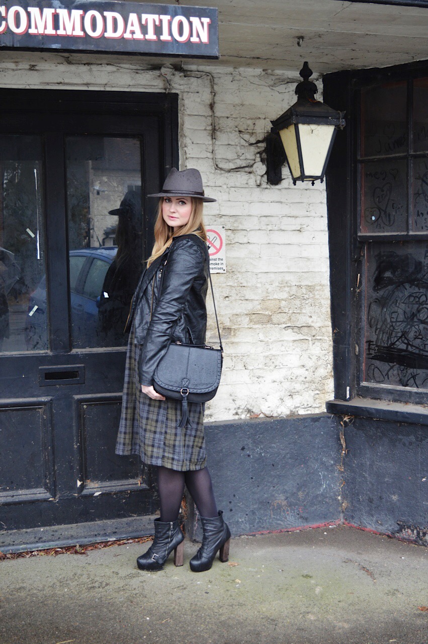 Leather jacket and tartan dress outfit inspiration by fashion blogger FashionFake