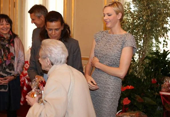 Prince Albert and Princess Charlene then handed out beautiful gifts to the 97 little ones
